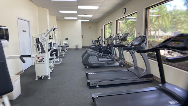 exercise room with a drop ceiling