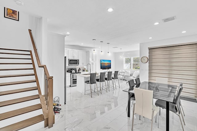 dining area featuring sink