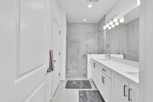 bathroom featuring an enclosed shower and vanity