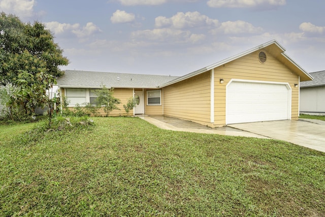 ranch-style home featuring a garage and a front yard