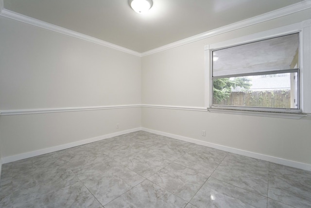 spare room featuring ornamental molding