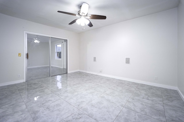 unfurnished bedroom featuring a closet and ceiling fan