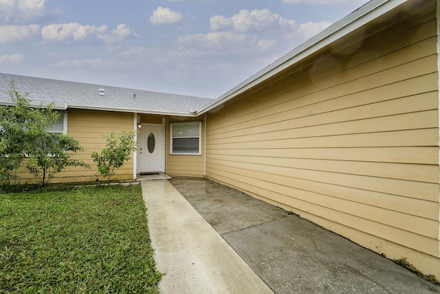 property entrance with a patio area