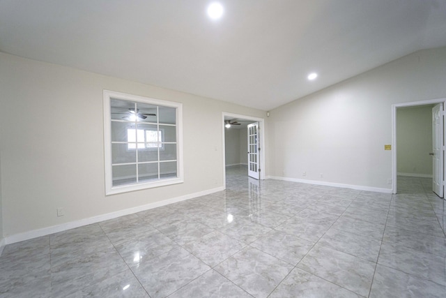 unfurnished room featuring ceiling fan and lofted ceiling