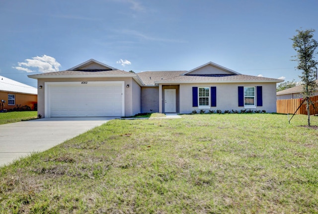 ranch-style home featuring a garage and a front lawn