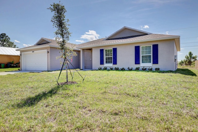 single story home with a garage and a front lawn