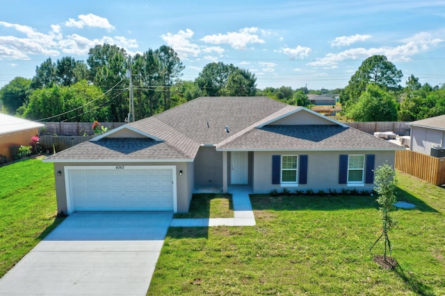 ranch-style home with a garage and a front yard