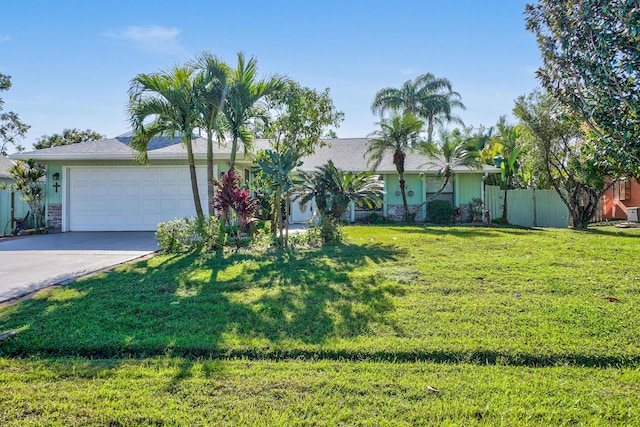 ranch-style house with a garage and a front yard