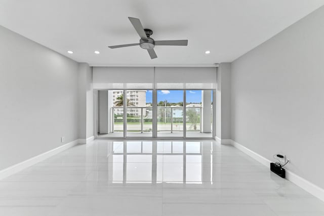 spare room with ceiling fan