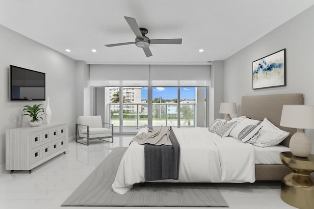 bedroom featuring expansive windows and ceiling fan