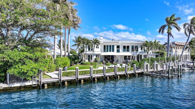 exterior space with a balcony and a water view