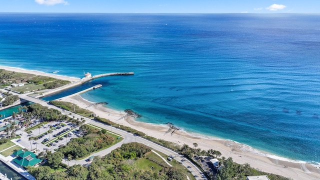 birds eye view of property featuring a view of the beach and a water view