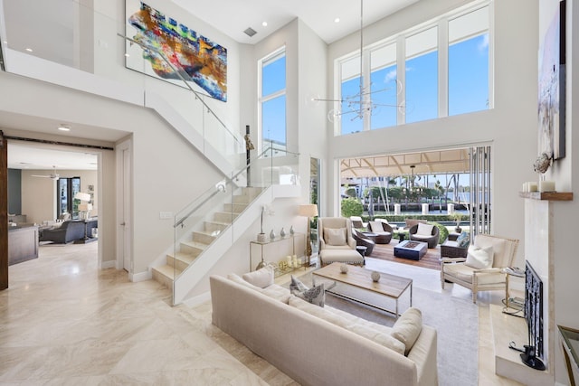 living room with a towering ceiling