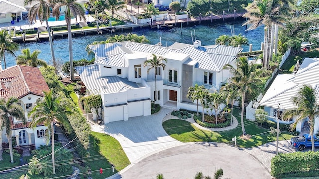 birds eye view of property with a water view