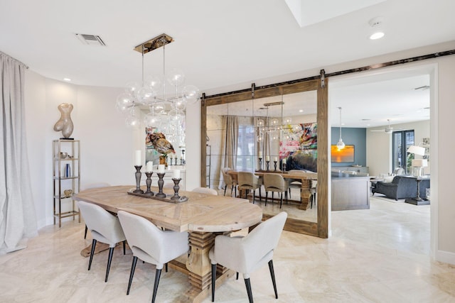 dining space with a barn door