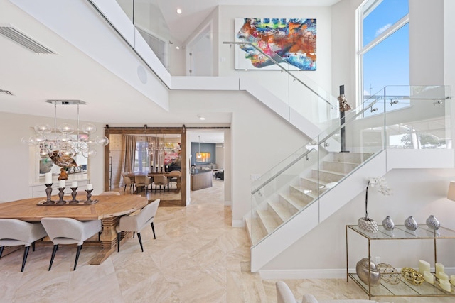 stairs featuring a high ceiling