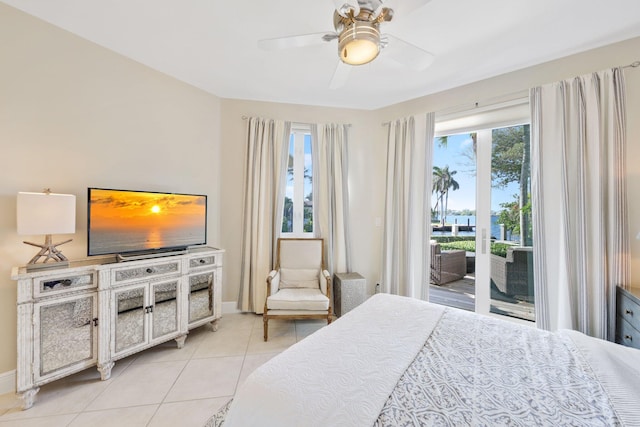 tiled bedroom featuring access to exterior and ceiling fan