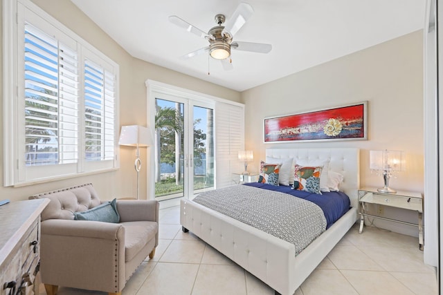 tiled bedroom featuring ceiling fan and access to exterior