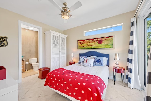 bedroom featuring light tile patterned flooring, ceiling fan, ensuite bath, and a closet