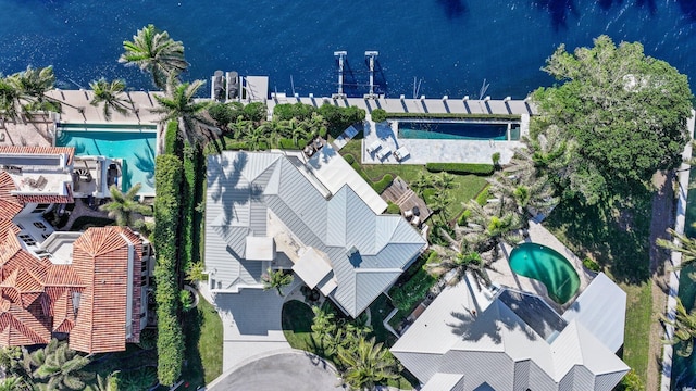 birds eye view of property featuring a water view