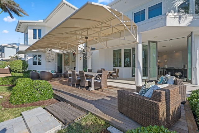 wooden deck with an outdoor living space