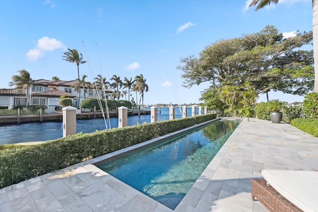 view of pool with a water view