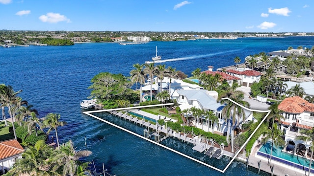 birds eye view of property with a water view