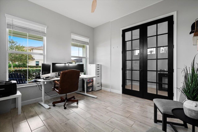 office with french doors and ceiling fan