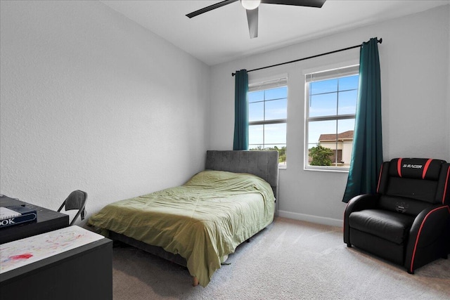 carpeted bedroom with vaulted ceiling and ceiling fan