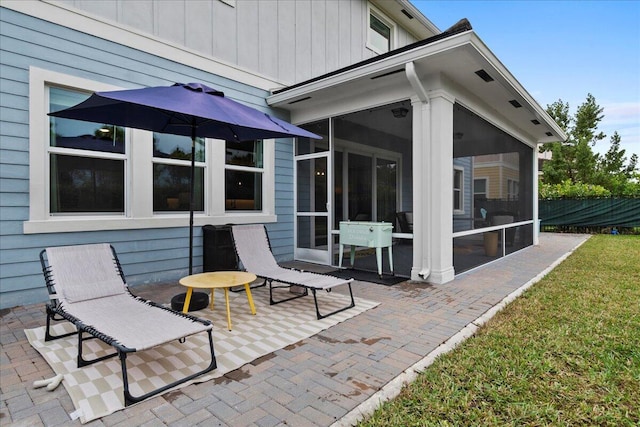 view of patio / terrace with a sunroom