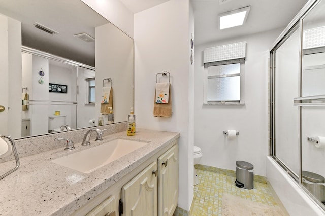 full bath with shower / bath combination with glass door, visible vents, toilet, and vanity