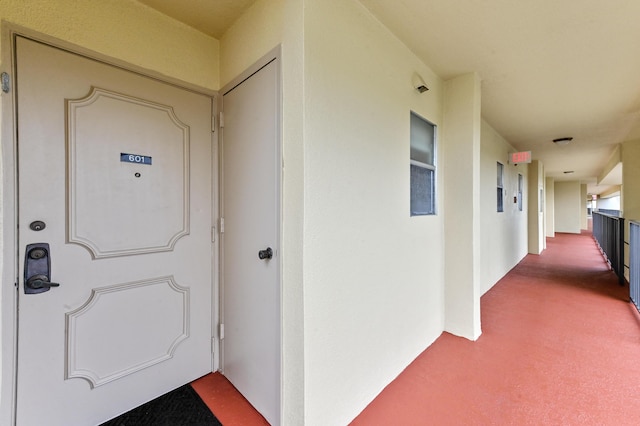 view of exterior entry featuring stucco siding