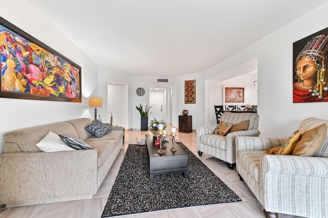 living area with light tile patterned flooring and visible vents