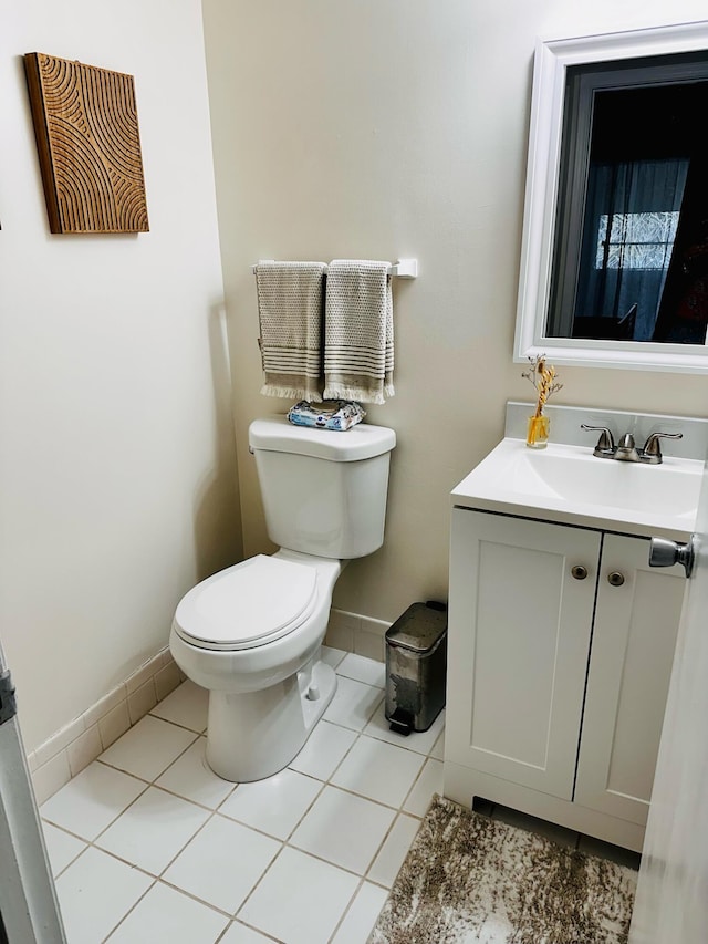 bathroom featuring vanity, toilet, and tile patterned flooring