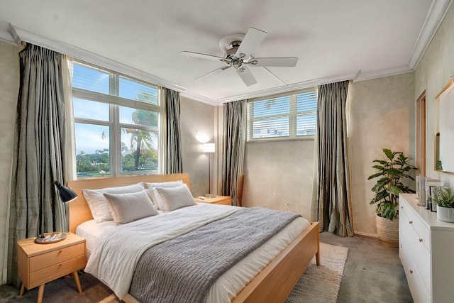 bedroom featuring multiple windows, light carpet, ornamental molding, and ceiling fan