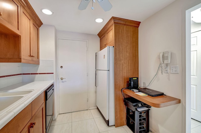 kitchen with light tile patterned flooring, dishwasher, decorative backsplash, white refrigerator, and ceiling fan