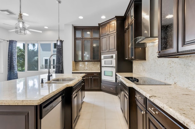 921 Osceola Dr Unit 11, Boca Raton, FL 33432 - kitchen with wall chimney range hood, black electric stovetop, a sink, visible vents, and dishwasher