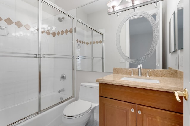 921 Osceola Dr Unit 11, Boca Raton, FL 33432 - bathroom with shower / bath combination with glass door, toilet, and vanity