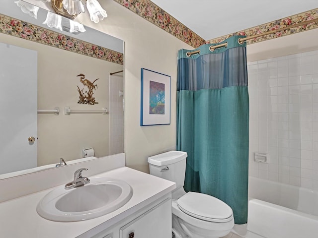 full bathroom featuring shower / bath combo with shower curtain, toilet, and vanity