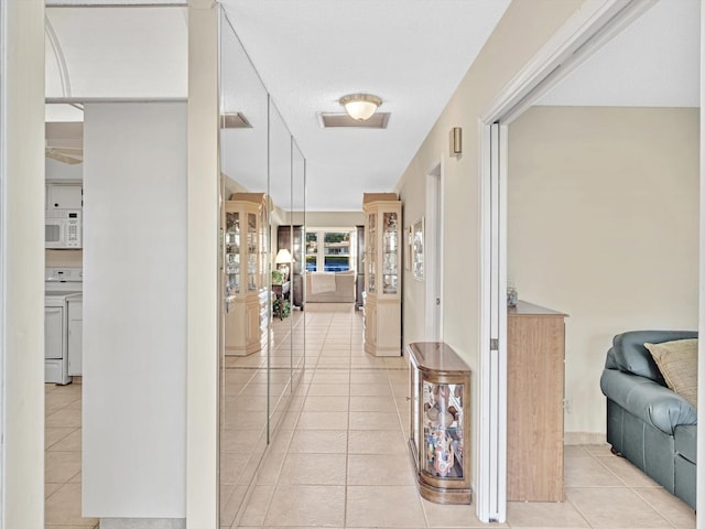 corridor with light tile patterned floors