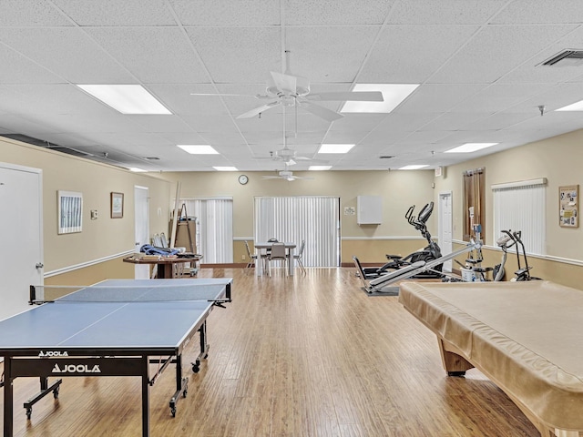 rec room with a paneled ceiling, ceiling fan, billiards, and hardwood / wood-style floors