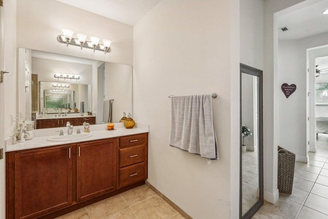 bathroom featuring vanity and tile patterned flooring