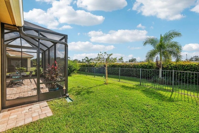 view of yard featuring glass enclosure