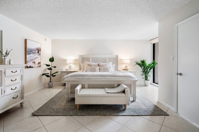 tiled bedroom with a textured ceiling