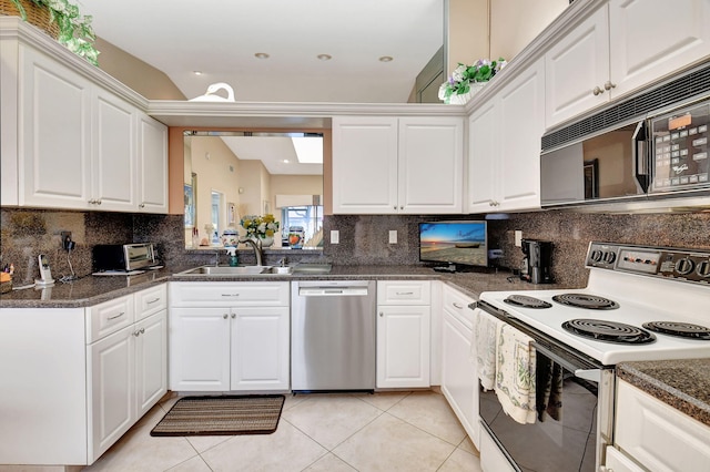 kitchen featuring sink, electric range, stainless steel dishwasher, and white cabinets