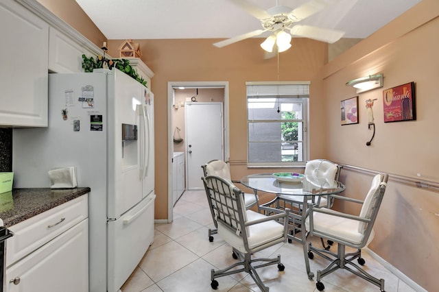 tiled dining area with ceiling fan