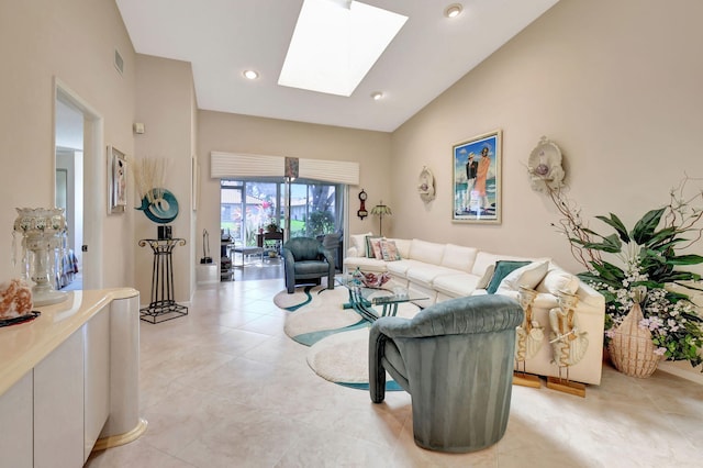 living room featuring vaulted ceiling with skylight