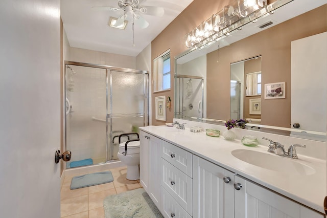 bathroom featuring tile patterned flooring, an enclosed shower, and a healthy amount of sunlight