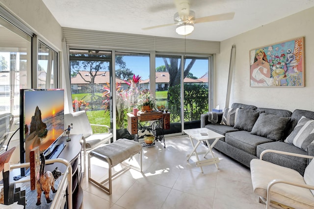 sunroom / solarium featuring ceiling fan