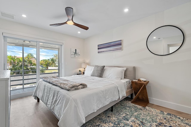 bedroom featuring ceiling fan, wood-type flooring, and access to outside